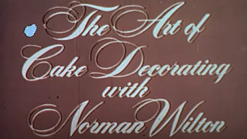 The Art Of Cake Decorating With Norman Wilton Backdrop Blur