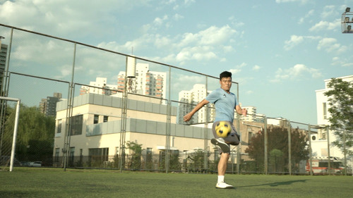 Tao - Fighting for Football in China Backdrop Blur