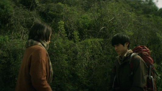 悼む人