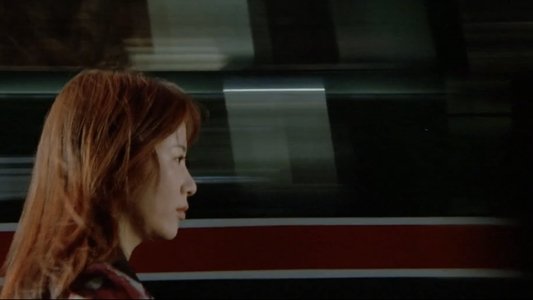 赫い髪の女