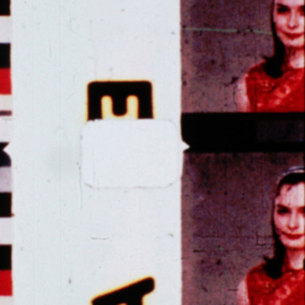 Film in Which There Appear Edge Lettering, Sprocket Holes, Dirt Particles, Etc.