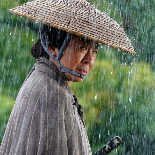 Neck Bowed in the Rain