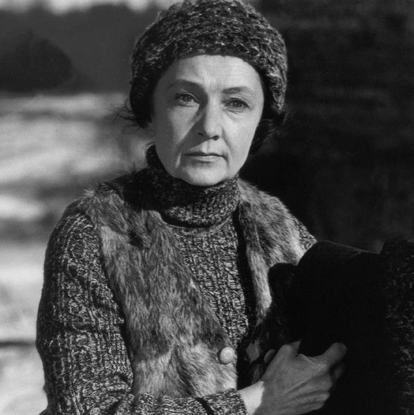 A Woman Heats the Sauna