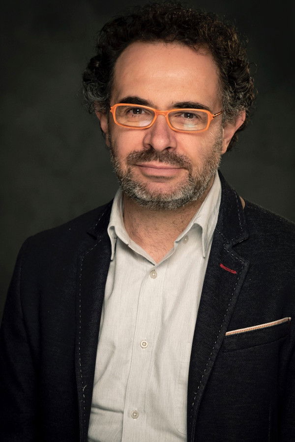 Mago More's headshot