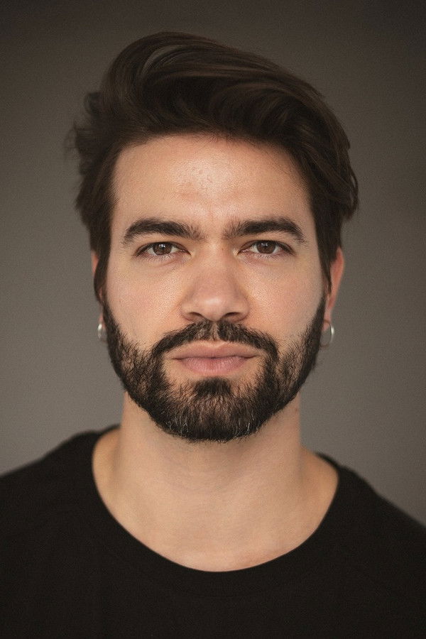 Eliot Tosta's headshot