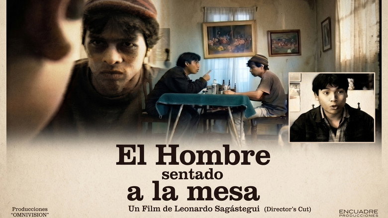 El hombre sentado a la mesa backdrop