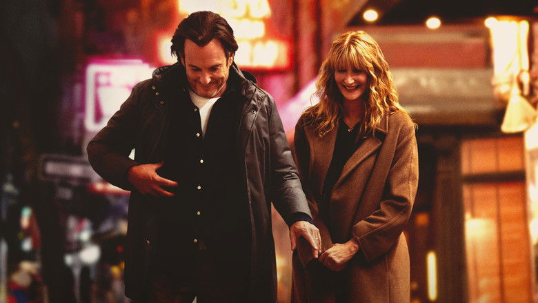 Laura Dern looking contemplative in a city setting