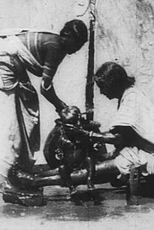 An Indian Washing the Baby (1906)