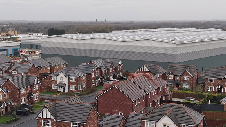 Giant warehouses built at the end of our gardens