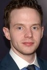 Mark O'Brien es Larsen Rogers