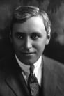 Mack Sennett isMan in checkered jacket and top hat