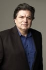 Oliver Platt isMan in Black Suit