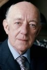 Alec Guinness isHenry 'Dutch' Holland