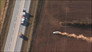 Car chase in a field