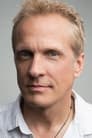 Patrick Fabian isHarvey Dent / Two-Face (voice)