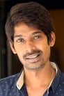 Dhanraj Sukhram isKarthik's coworker (Telugu Version)