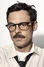 Scoot McNairy isTom Ewell / Richard Sherman