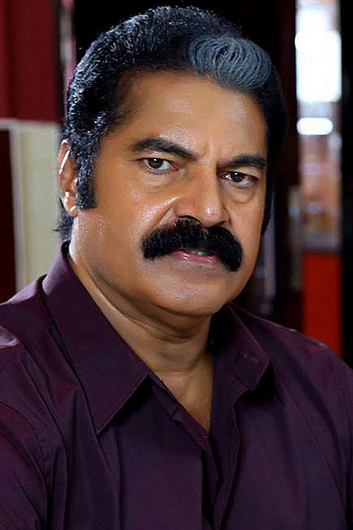 Satheesh Menon as Raman Chekaver in Veeram