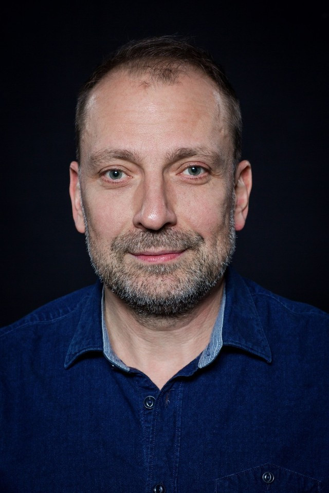 Sławomir Grzymkowski as Ojciec Adasia in Real