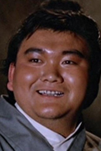 Lau Kwan as Inspector's Assistant in Temptress of a Thousand Faces