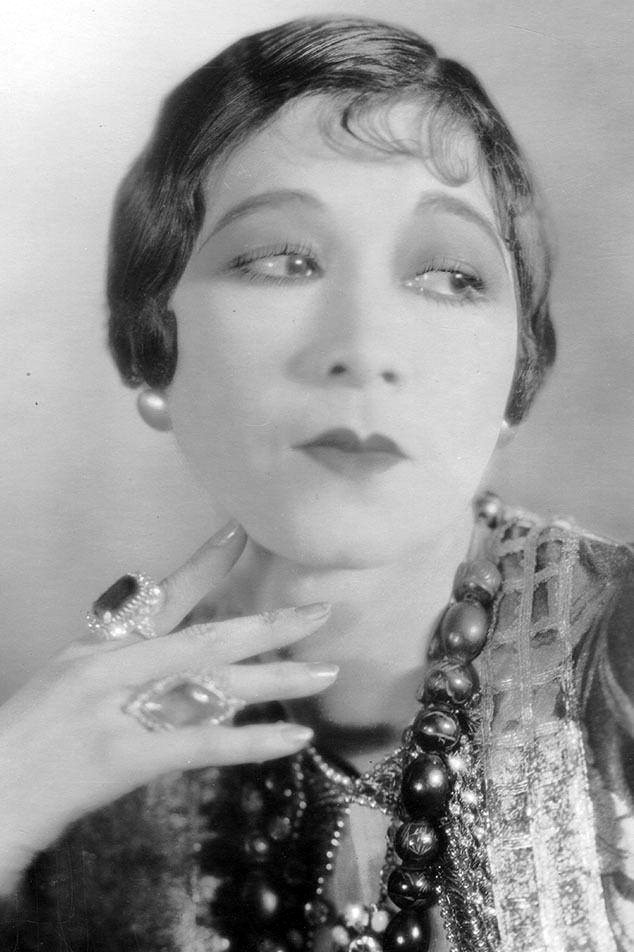 Etta Lee as Gossip in The Toll of the Sea