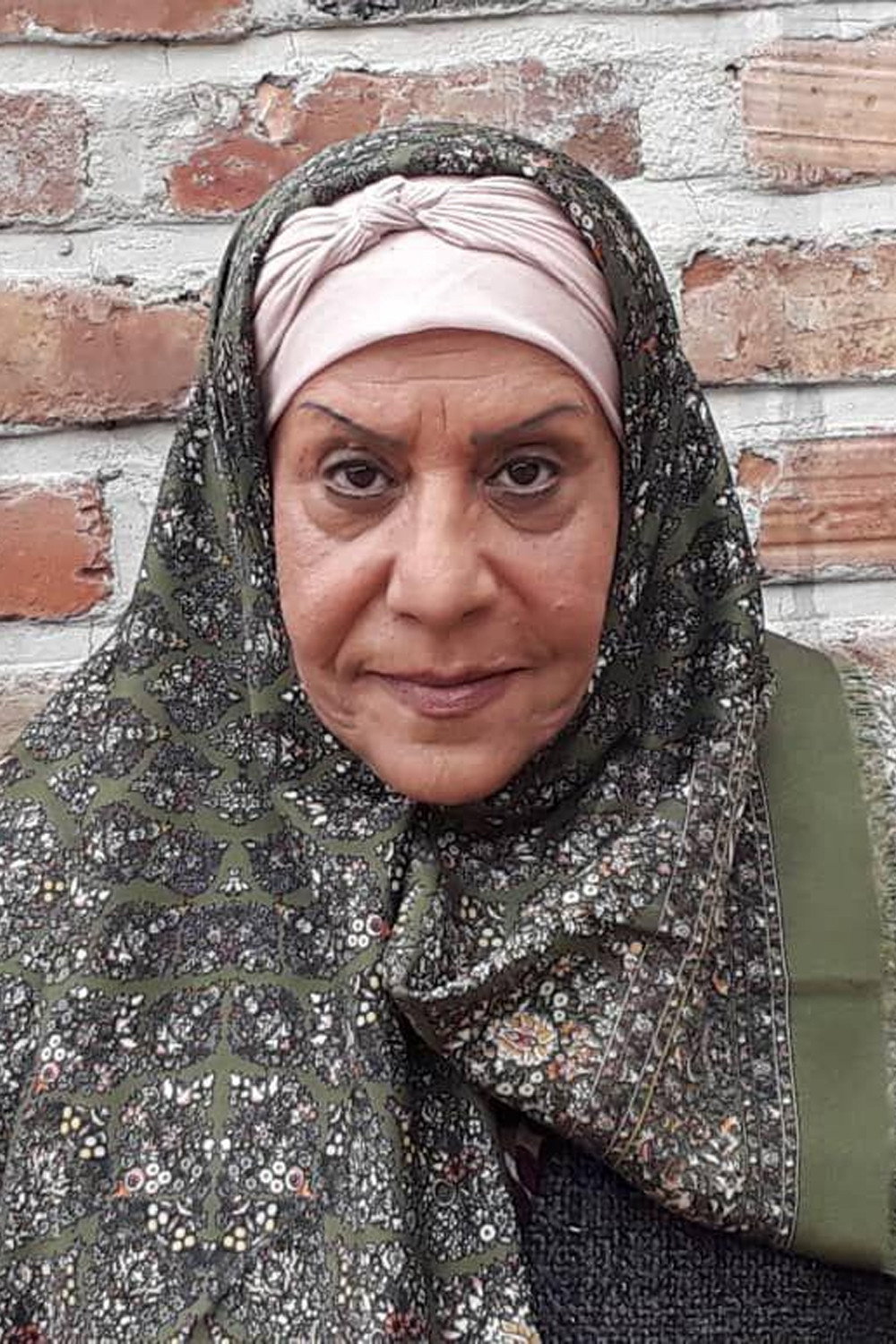 Shahrbanoo Mousavi as Tayebeh Khanoom in The Feisty Rooster
