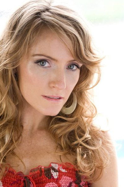 Helene Joy as Judy Surgick in An American in Canada