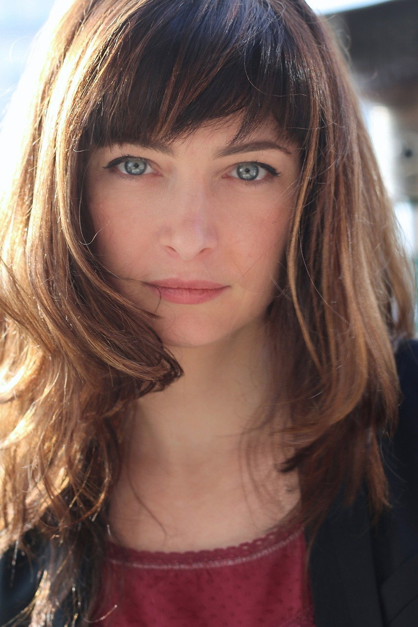 Stéphanie Papanian as Coralie, l'assistante in Up for Love