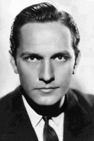 Fredric March as Tom Chambers in Design for Living