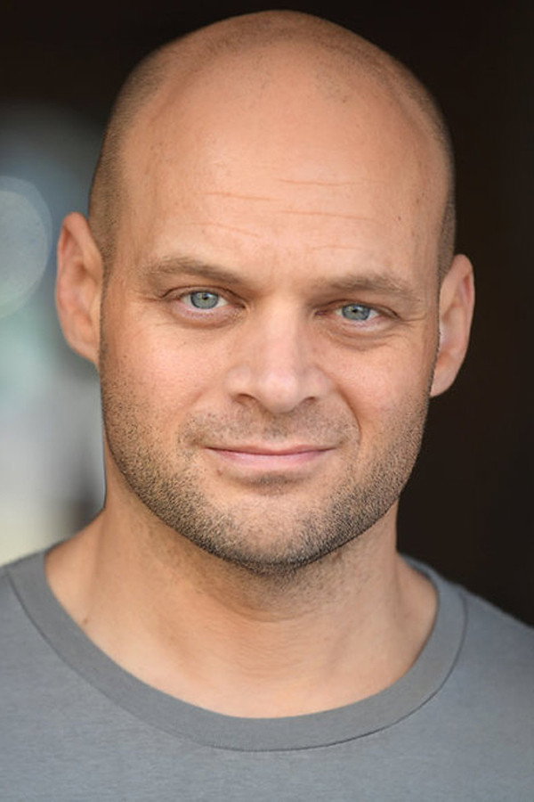 Ryan Scott Thomas as Officer Kennedy in President's Day