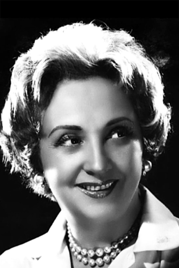 Iris Marga as Mama Victoria in Miss Mary