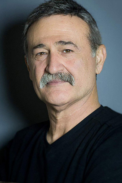 Müfit Kayacan as Hikmet in La Belle Indifference