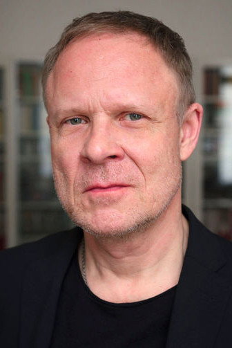 Helmut Zhuber as Latin teacher Dr. Gebhard in Brecht