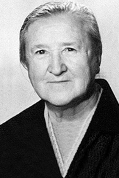 Александра Денисова as the Stepmother (voice) in The Miraculous Bell
