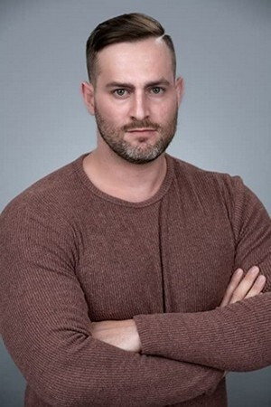 Justin Louis Weiss as Corporal Dickerson in Dog