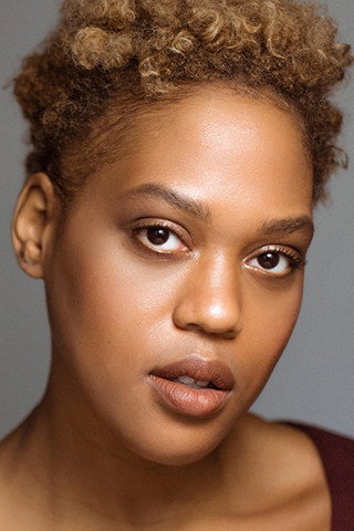 Antoinette Crowe-Legacy as Elise Johnson in Godfather of Harlem