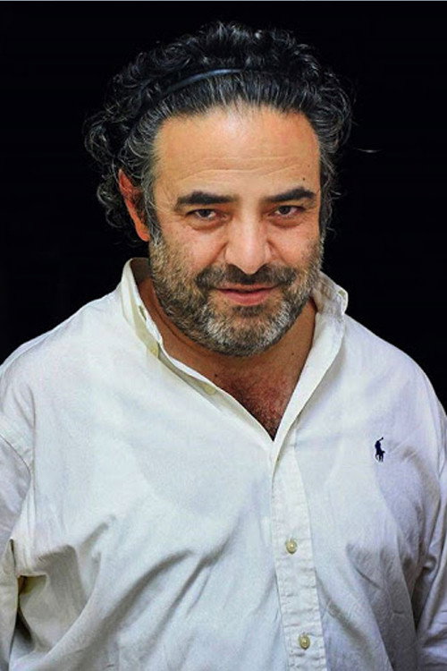Hasan Ma'juni as Hasan Kasmai - The Director in Pig