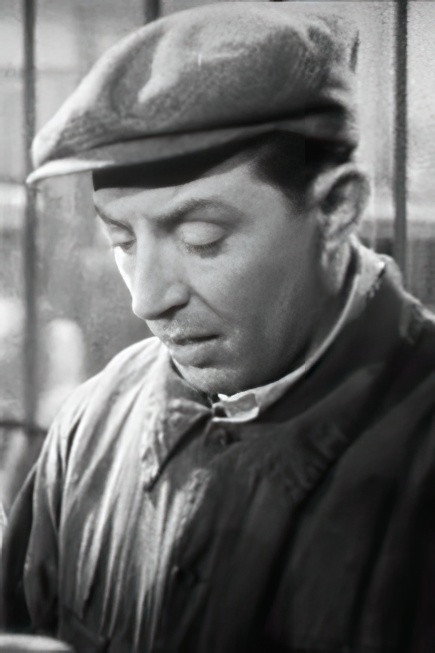 Marcel Melrac as Garage owner in The Inevitable Mr. Dubois