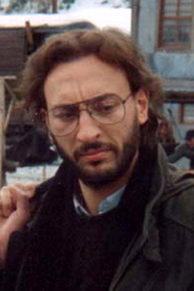 Γρηγόρης Πατρικαρέας as Alexandre the Reporter in The Suspended Step of the Stork