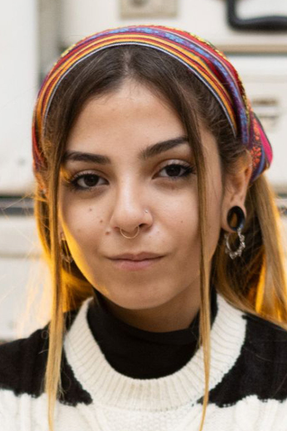 Salua Hadra as Alex in The Girls at the Station