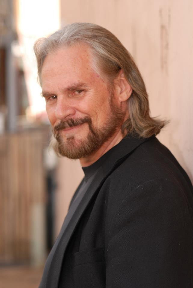 Rob Edwards as Frank Holloway in New World Order: The End Has Come