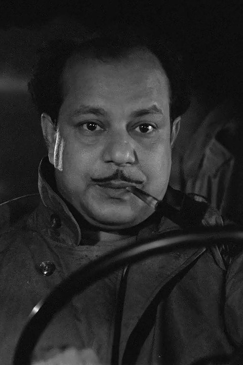 Haradhan Bandopadhyay as Das Saheb in Jake Ghoosh Dite Hoy