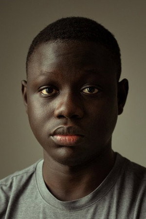 Clément Sambou as Adama in Father & Soldier