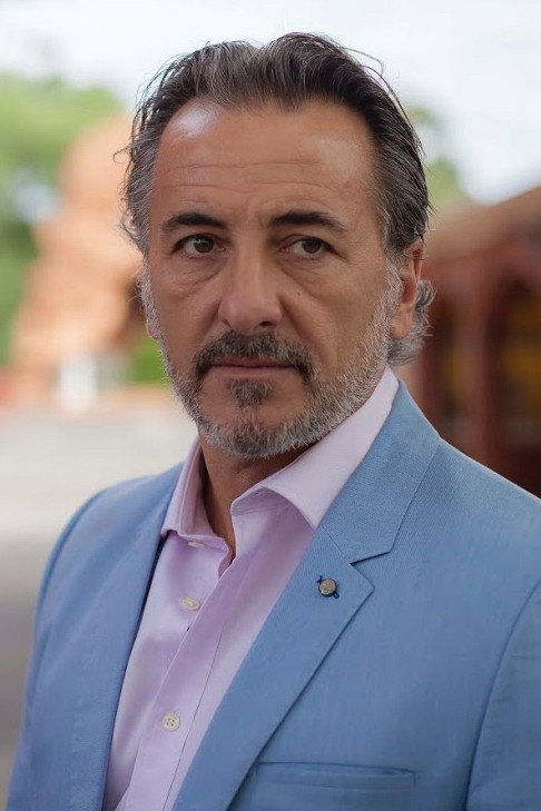Mirko Grillini as Montgomery Lomax in Agent Provocateur