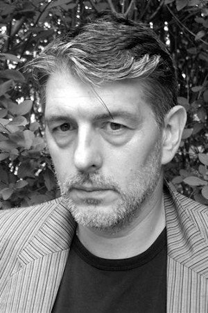 Grigori Manoukov as Boris in Triple Agent