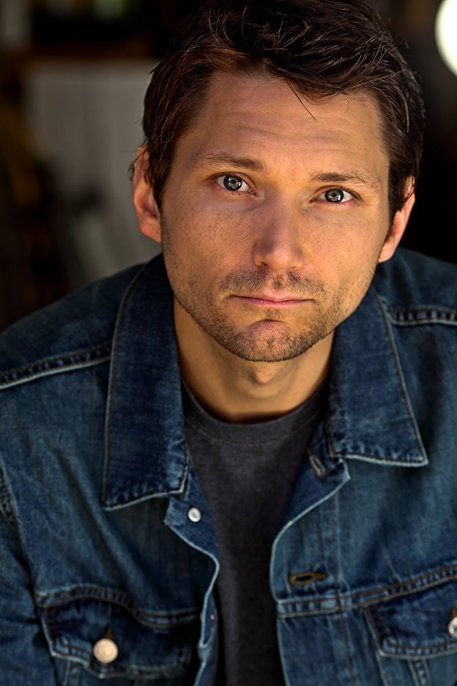 Dusty Mitchell as Azbell in Behind the Movement