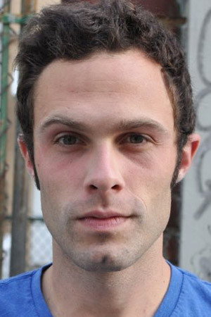 Jake Paque as Robert Wilson in How We Built the Bomb