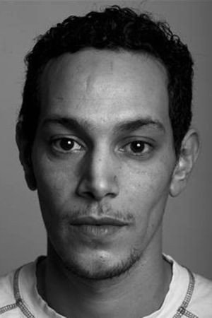 Ouassini Embarek as Kamel in A Family of Bastards