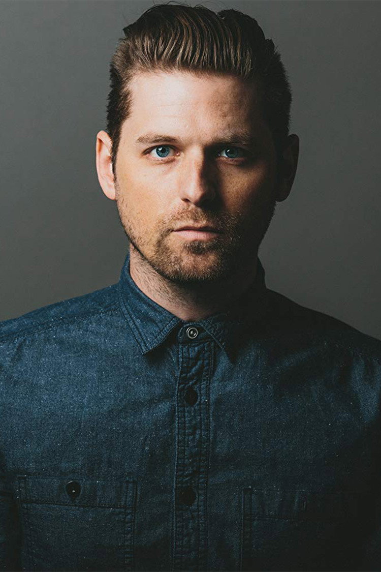 Brian W. Foster as Host in Between the Sheets