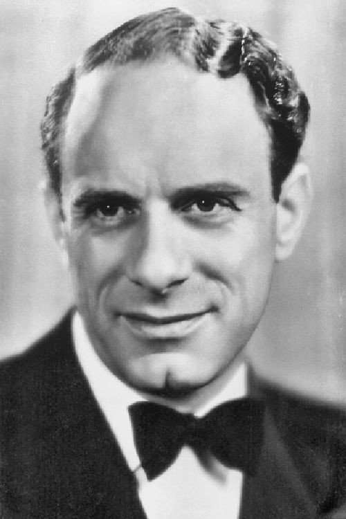Vic Oliver as Tremayne in Rhythm in the Air